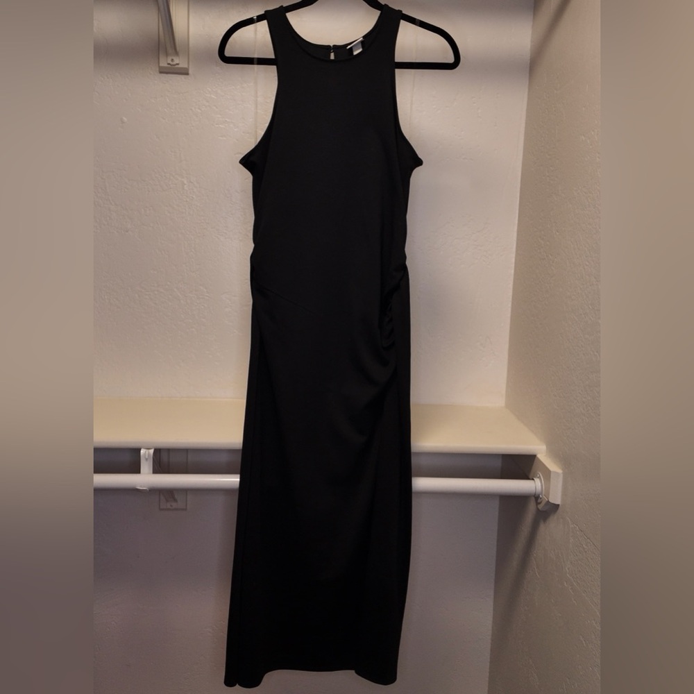 Black calf length body-con dress.